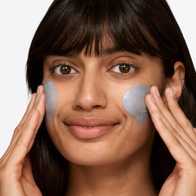 Clinique scrub action massaged on hand showing gentle exfoliation benefits