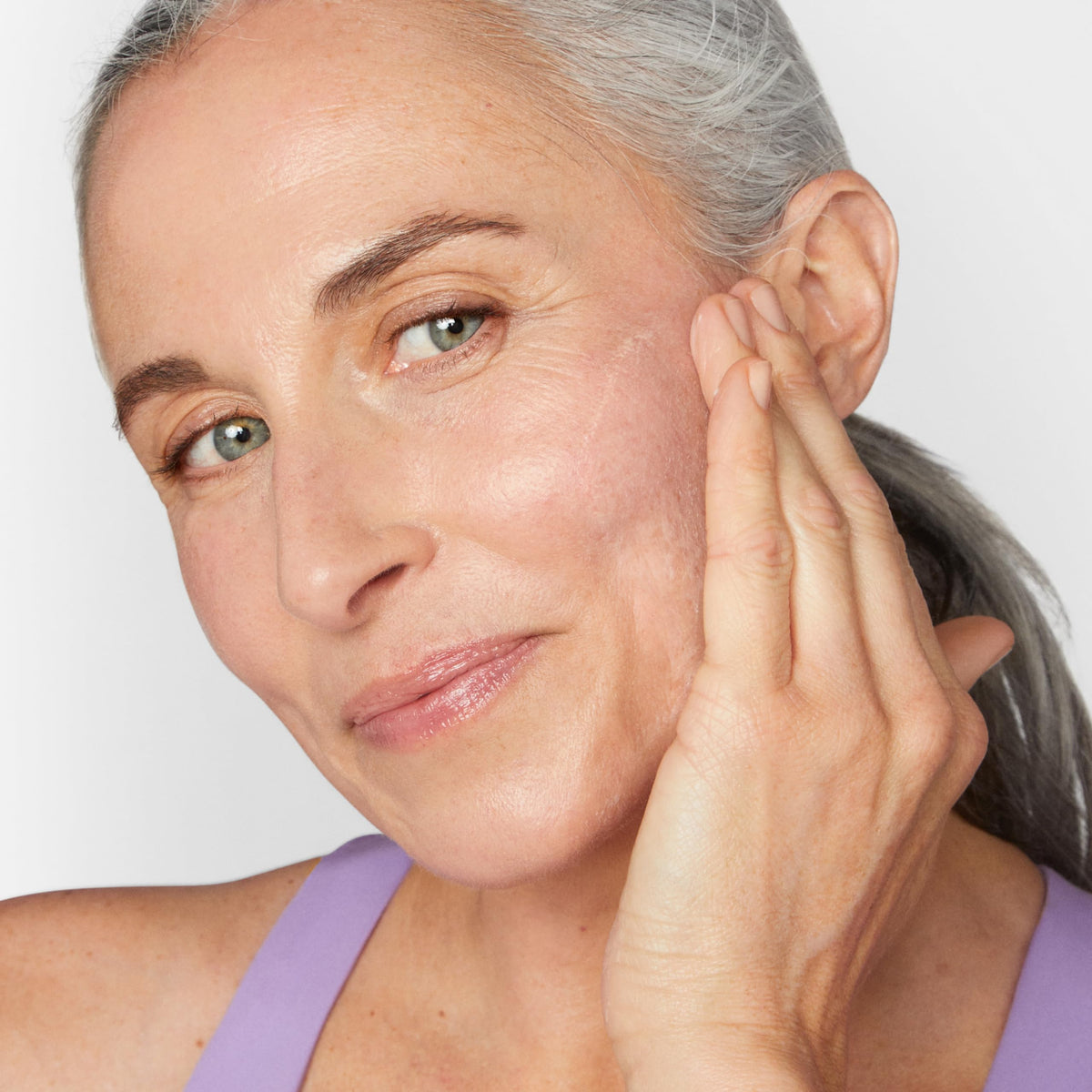 Clinique cream being applied to cheek demonstrating immediate plumping effect