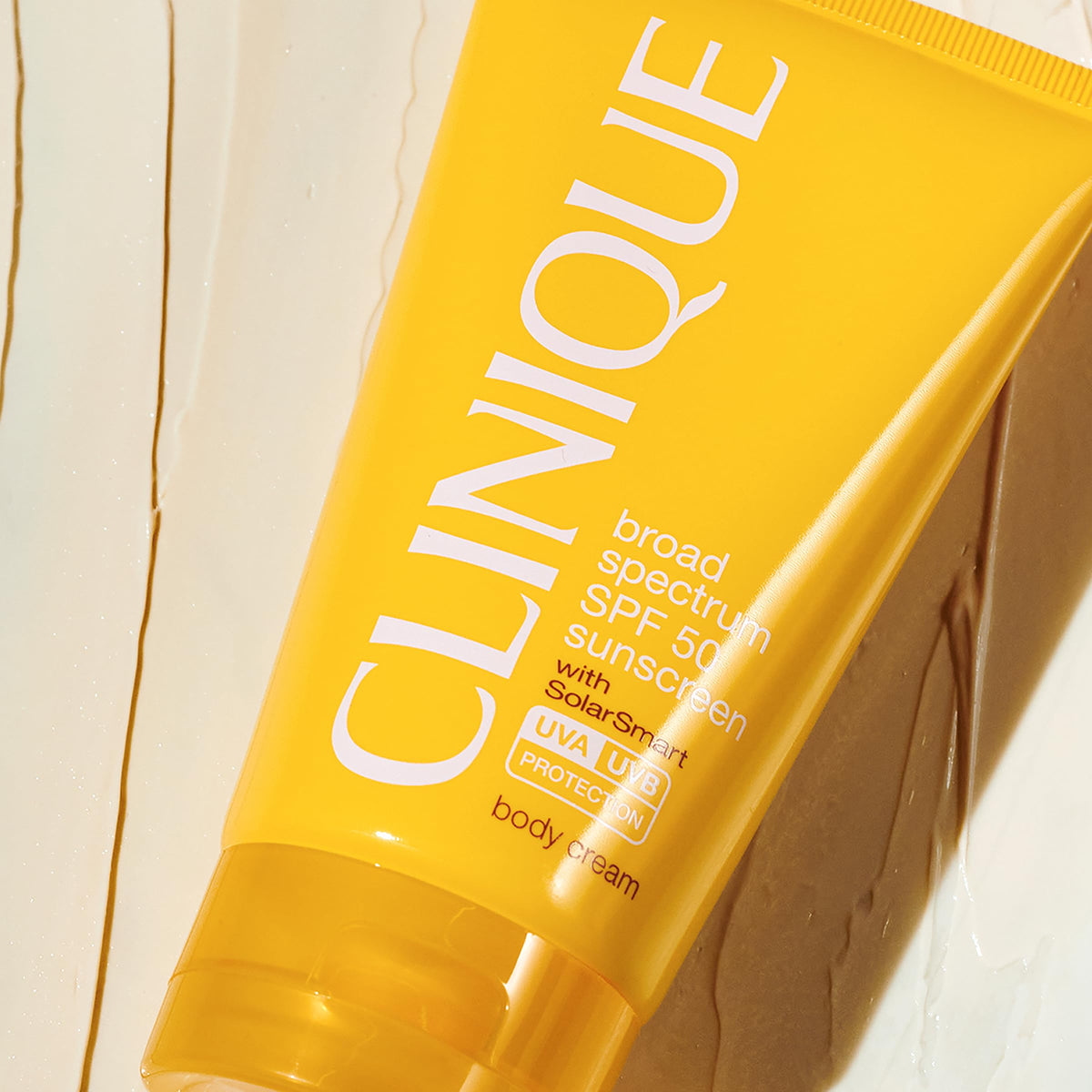 Clinique SPF 50 cream texture close-up demonstrating lightweight absorbency