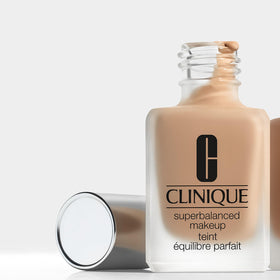Clinique foundation applied to cheek with brush, demonstrates balanced finish