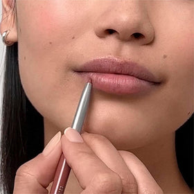 Clinique swatch on arm in cranberry illustrating rich pigment and blending ease
