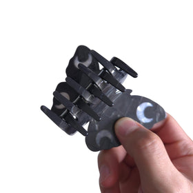 Clip Sugar clip beside a ruler to show scale and easy portability benefit