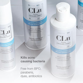CLn bottle in hand for size comparison showing portable eight fluid ounce benefit