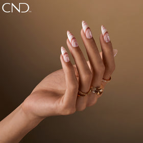 CND Beau on desk lifestyle shot showing wearable everyday elegance