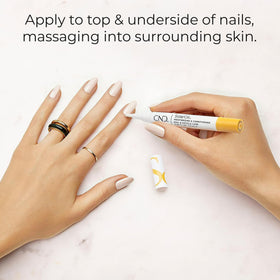 CND SolarOil being applied to a cuticle to soften and hydrate the nail edge