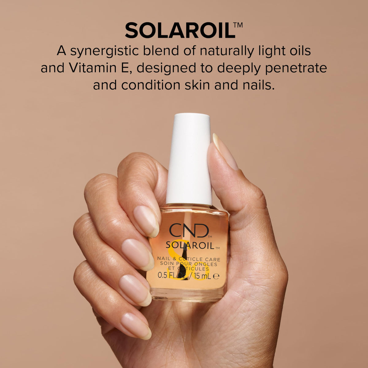 CND SolarOil droplet close-up on fingertip, highlights fast absorption benefit