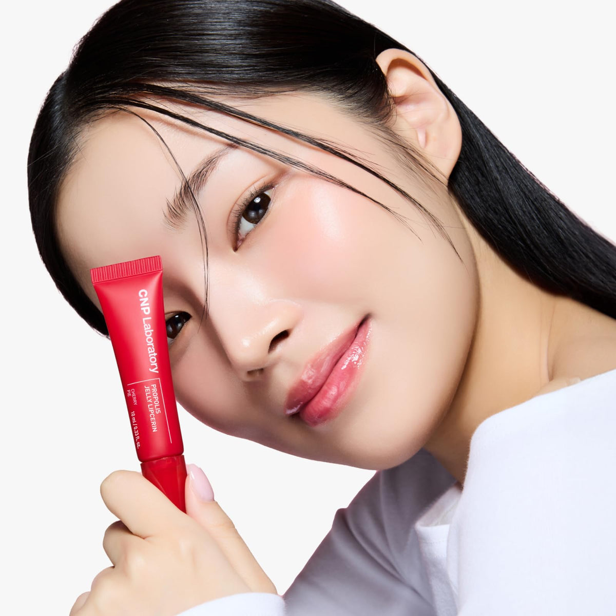 CNP Propolis Lipcerin glossy texture smeared to show sheen and hydrating finish