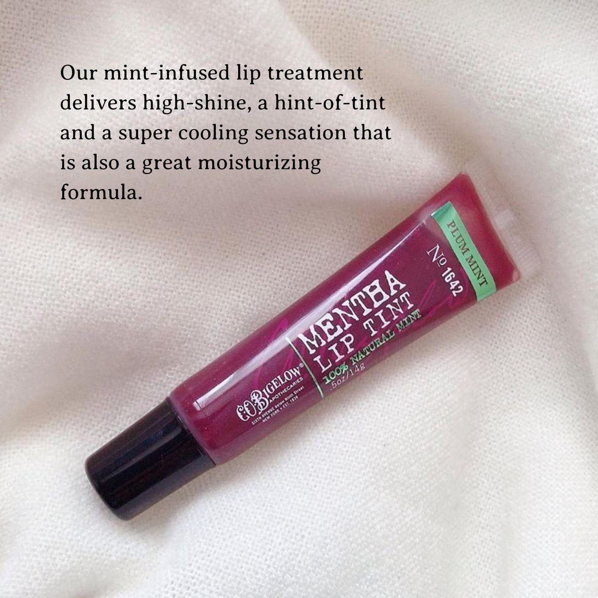 C.O. Bigelow applied on lips demonstrating sheer plum tint and shine benefit