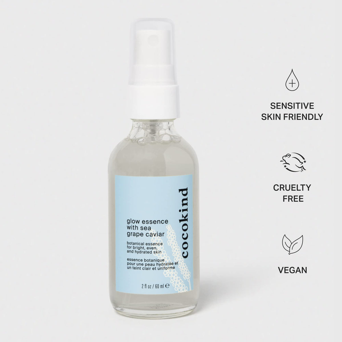 Cocokind bottle in hand for size comparison and easy portable skincare
