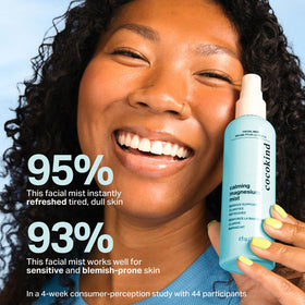 Cocokind bottle in hand demonstrating travel-friendly 4 fl oz size