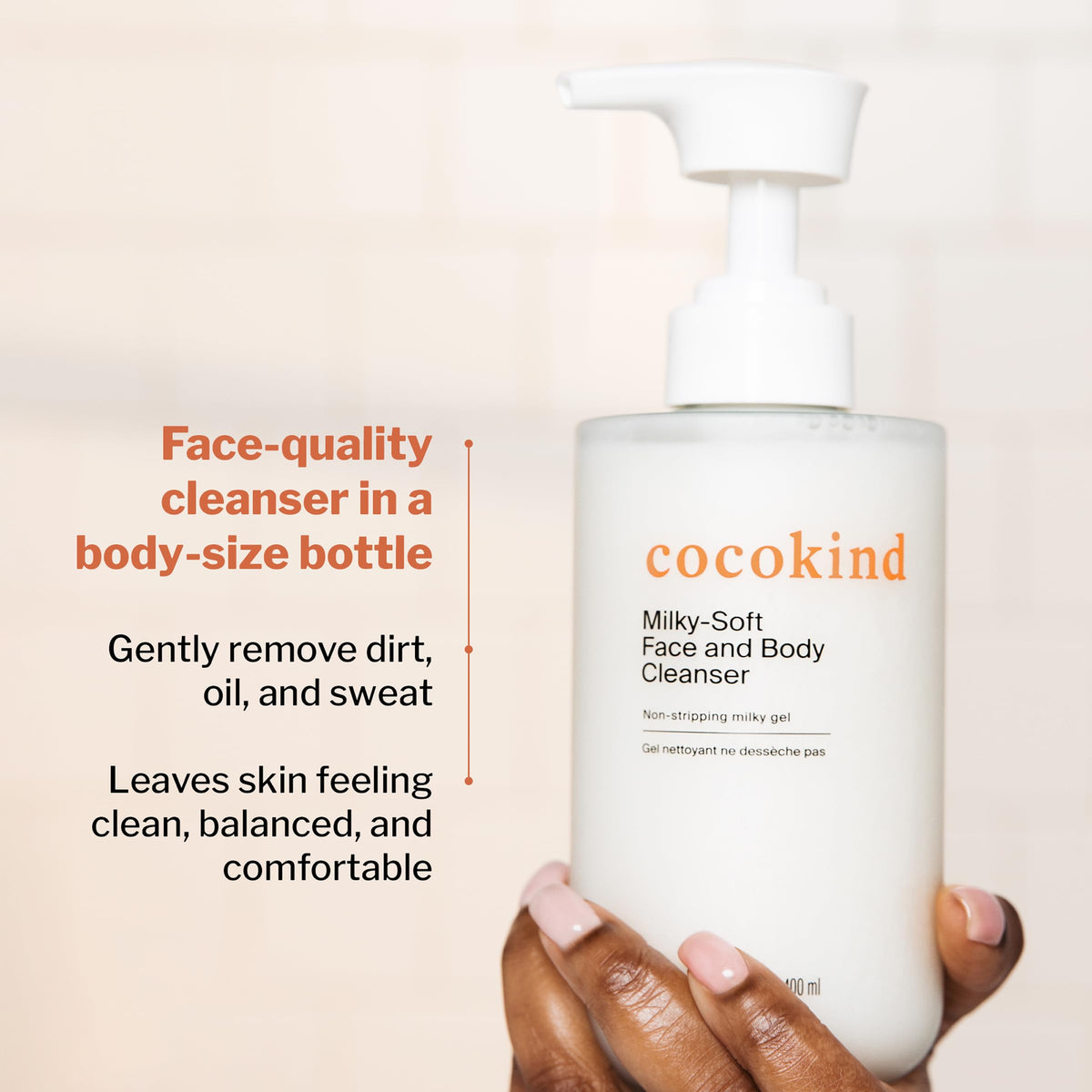 Cocokind bottle next to hand showing 13.5 oz size