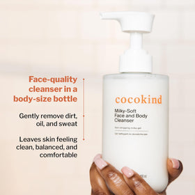 Cocokind bottle next to hand showing 13.5 oz size
