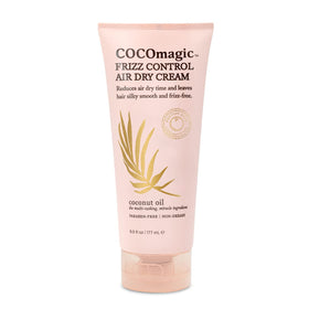 Cocomagic jar on bathroom shelf in styling routine conveying daily frizz-smoothing use