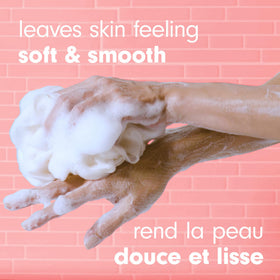 Colgate Softsoap pump dispensing creamy lather, demonstrates easy use and rich foam