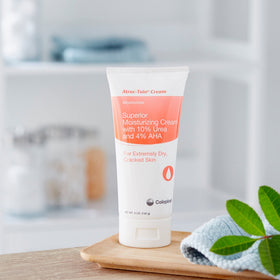 Coloplast Atrac-Tain held in hand for size comparison showing travel-friendly 5 oz convenience