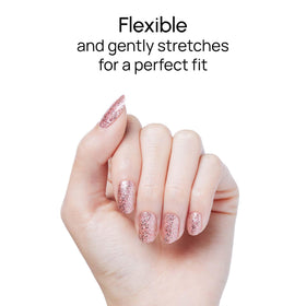 Color Street nails worn at party showing eye-catching rose gold glitter finish