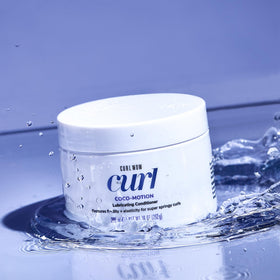 COLOR WOW pouring Coco-Motion texture to show lightweight slip benefit