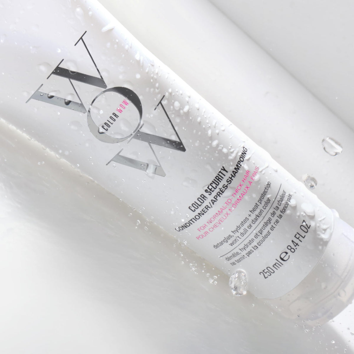 COLOR WOW applying conditioner to wet hair for easy detangling