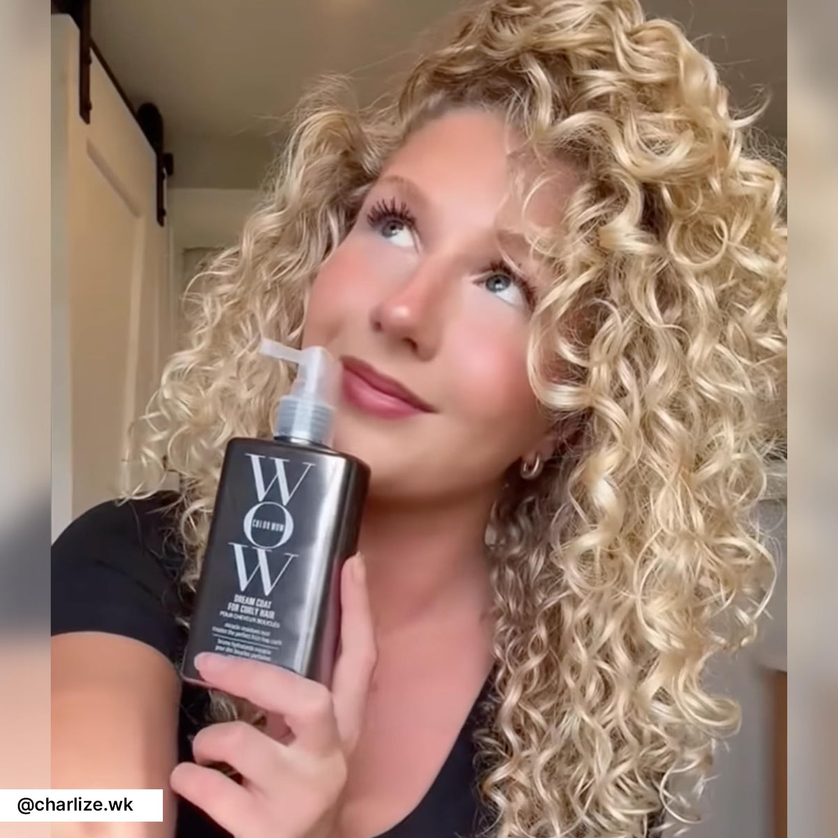 COLOR WOW bottle held in hand for scale, communicates travel-friendly styling benefit