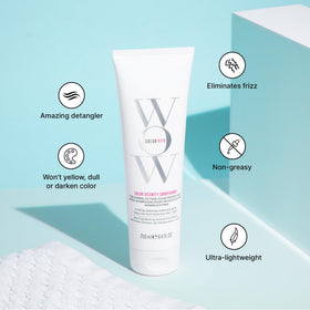 COLOR WOW duo bottles in hand to show true size and travel-friendly benefit