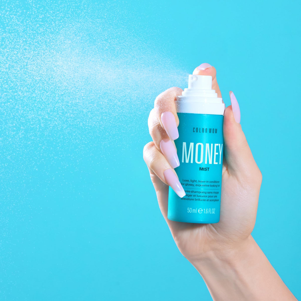 COLOR WOW bottle in hand showing size and convenience for travel and daily use