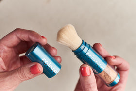 Colorescience open brush showing finely milled bronze powder for seamless blending