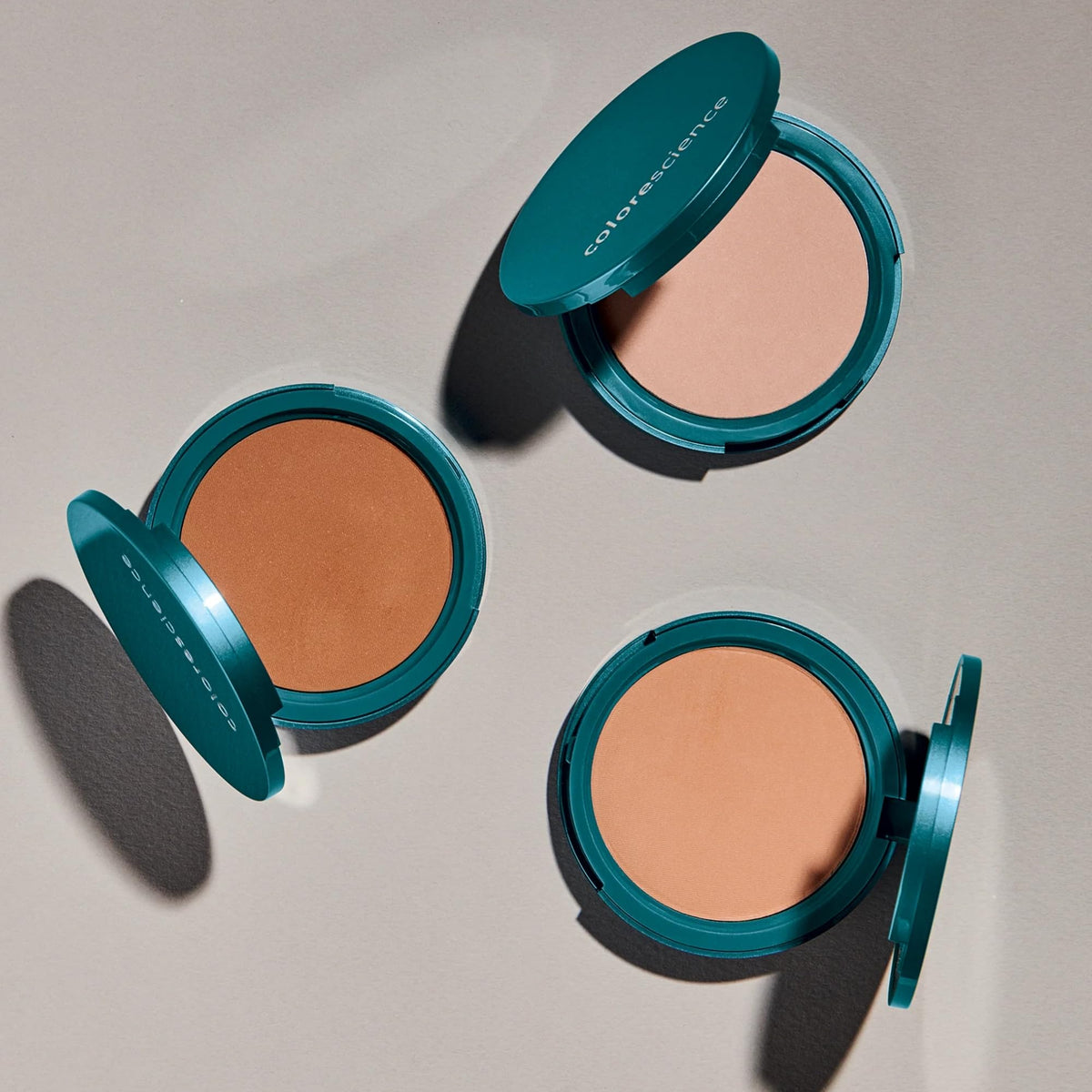 Colorescience application with brush demonstrating buildable medium-to-full coverage benefit