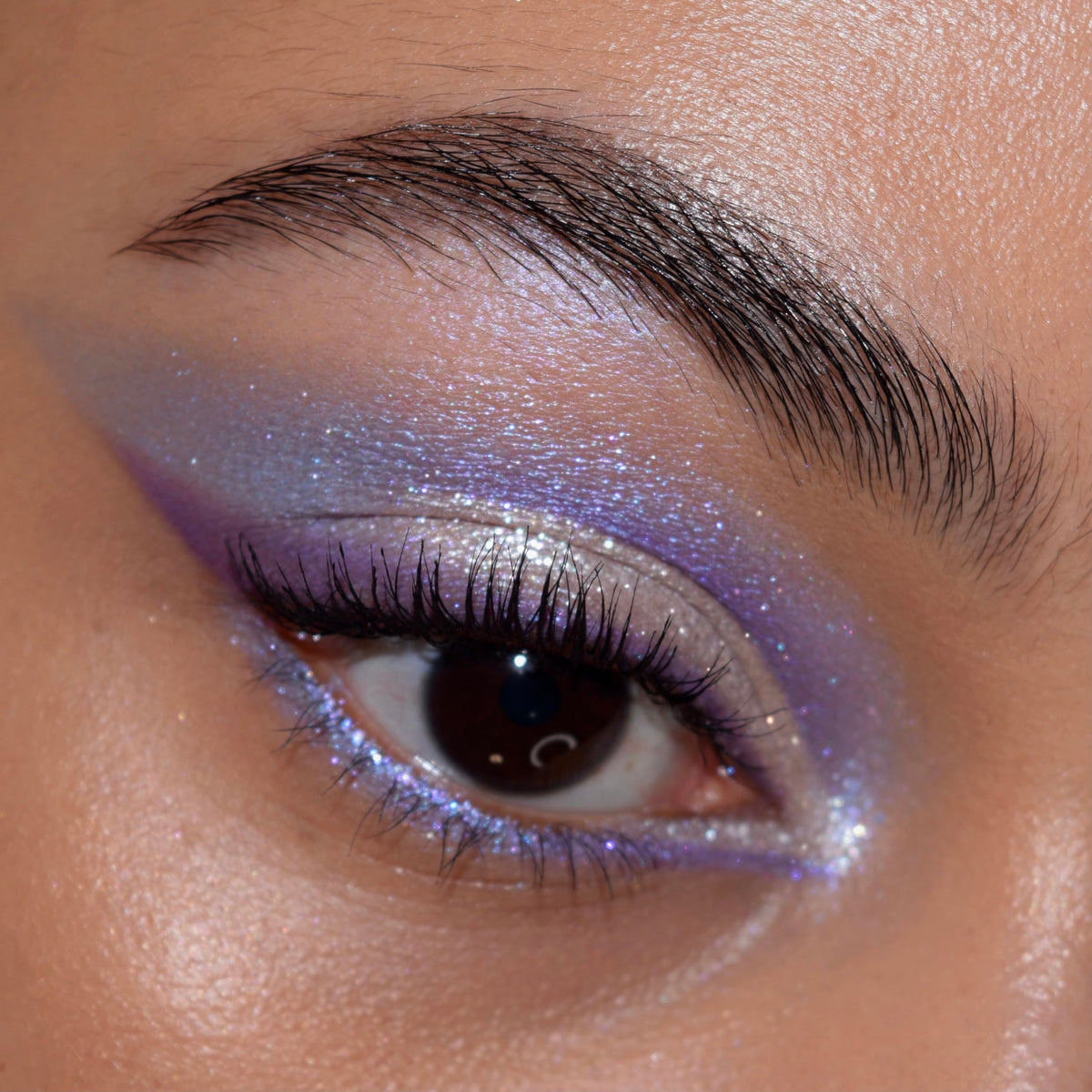 ColourPop fingertip pressing duo‑chrome to intensify shimmer and color shift