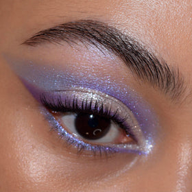 ColourPop fingertip pressing duo‑chrome to intensify shimmer and color shift