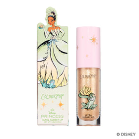 ColourPop Ambitious Tiana flatlay with Disney-themed props adding playful beauty appeal