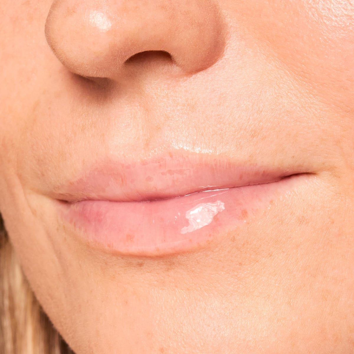 ColourPop balm applied on lips showing dewy shine and plump appearance benefit