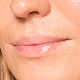 ColourPop balm applied on lips showing dewy shine and plump appearance benefit