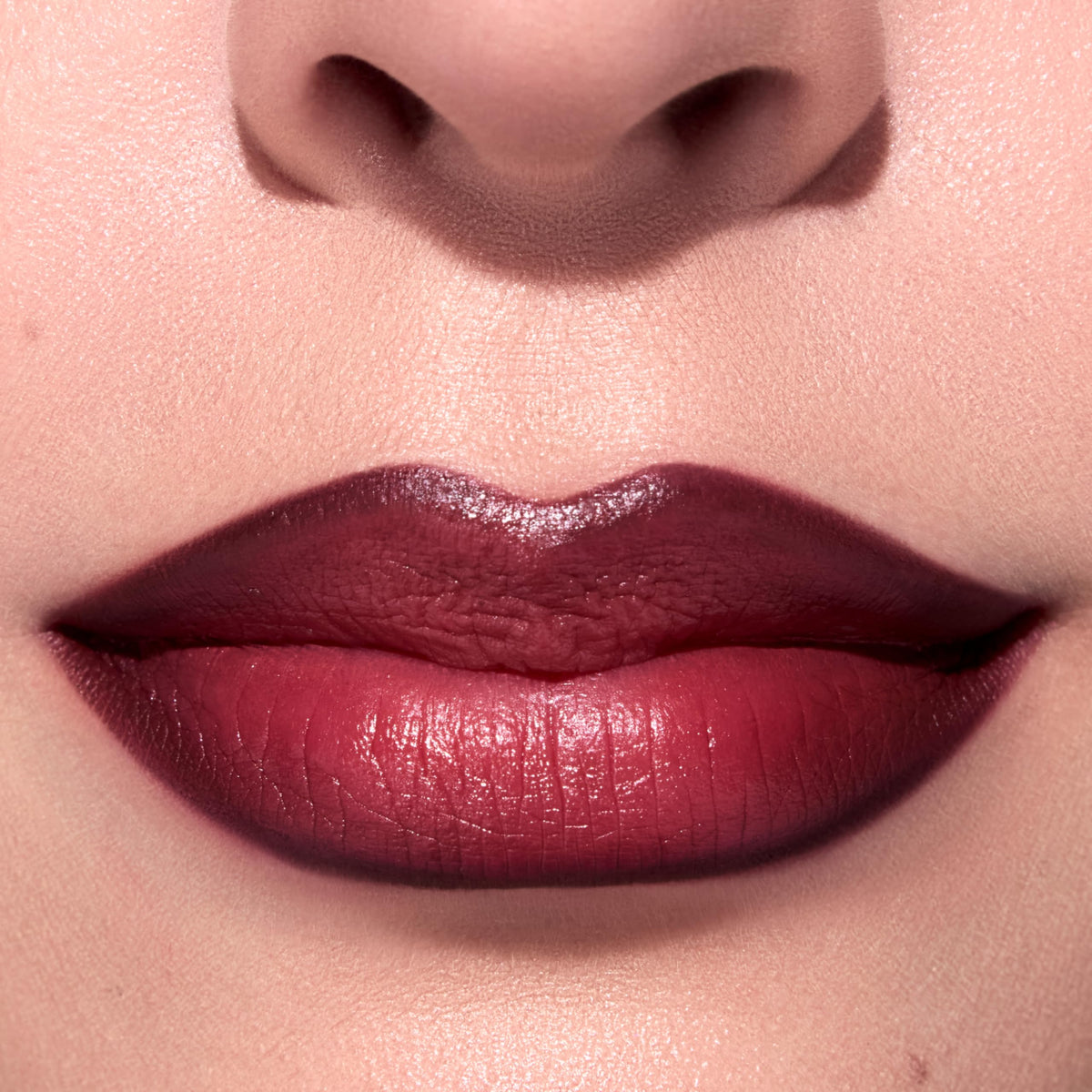 ColourPop arm swatches of warm burgundy and brown showing true-to-shade payoff