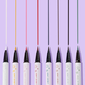 ColourPop model applying liner to eyelid showing sharp wing and long-lasting wear