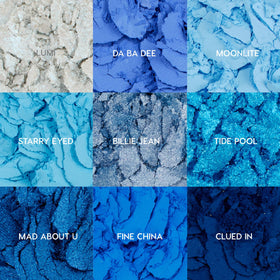 ColourPop open palette sitting on table displaying all twelve blue shades
