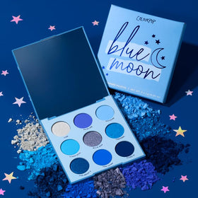 ColourPop palette next to compact mirror showing compact travel-friendly size
