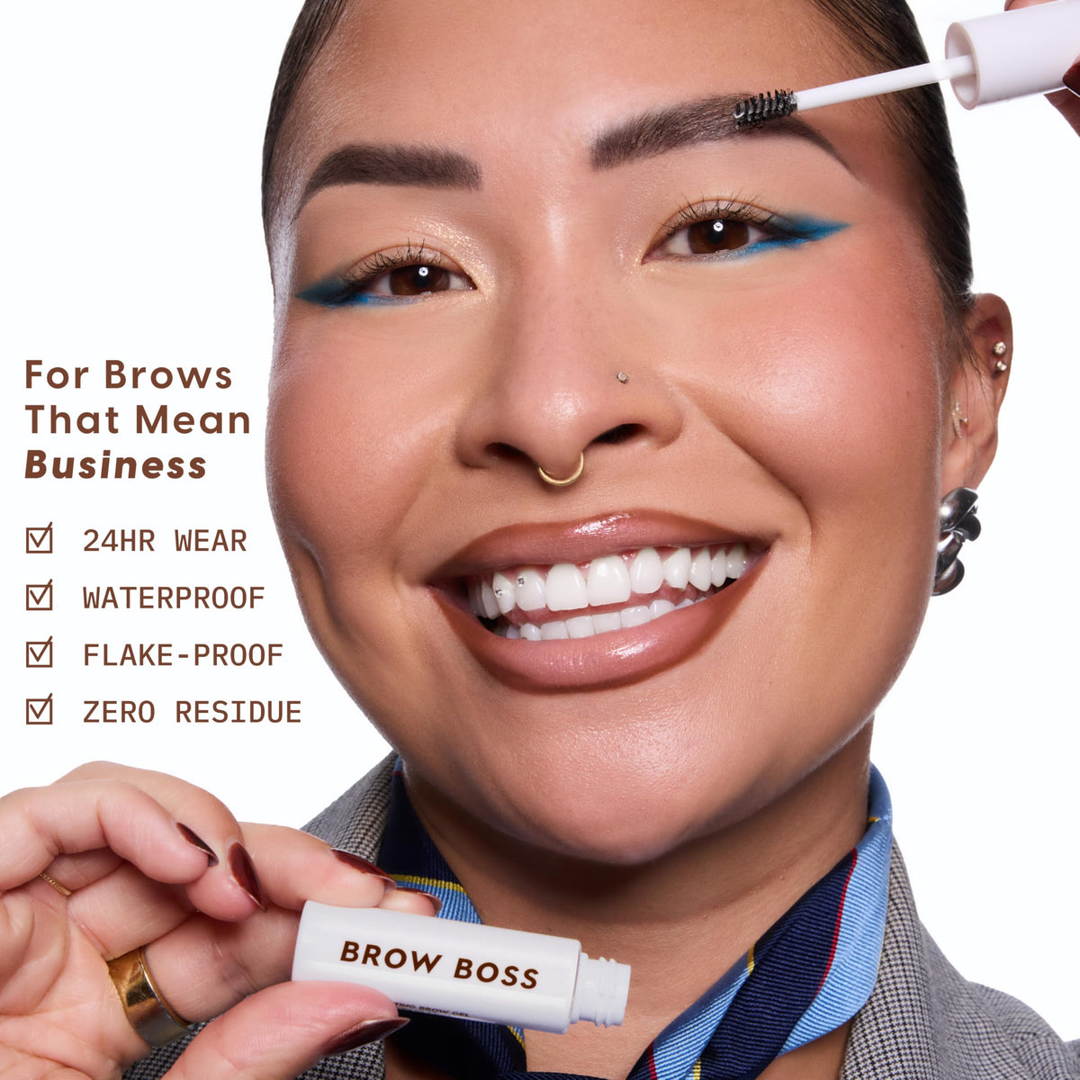 ColourPop Brow Boss next to a hand to show compact travel-friendly size and portability