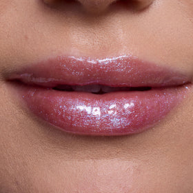 ColourPop Courageous Rapunzel swatch on arm showing pinky-lilac shimmer and hydration
