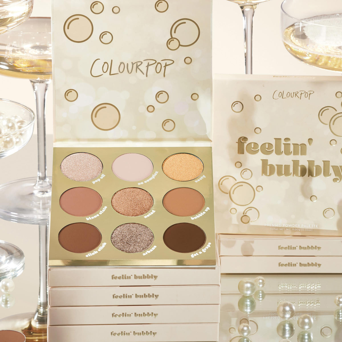 ColourPop palette beside a coin showing compact travel-friendly size