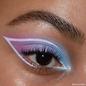 ColourPop applying shade with brush on eyelid for precise pigment and easy blending