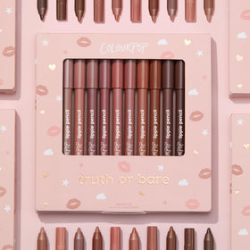 ColourPop pencil held in hand to show compact travel-friendly size