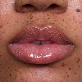 ColourPop Mademoiselle Belle gloss on lips closeup showing high shine and smooth comfort