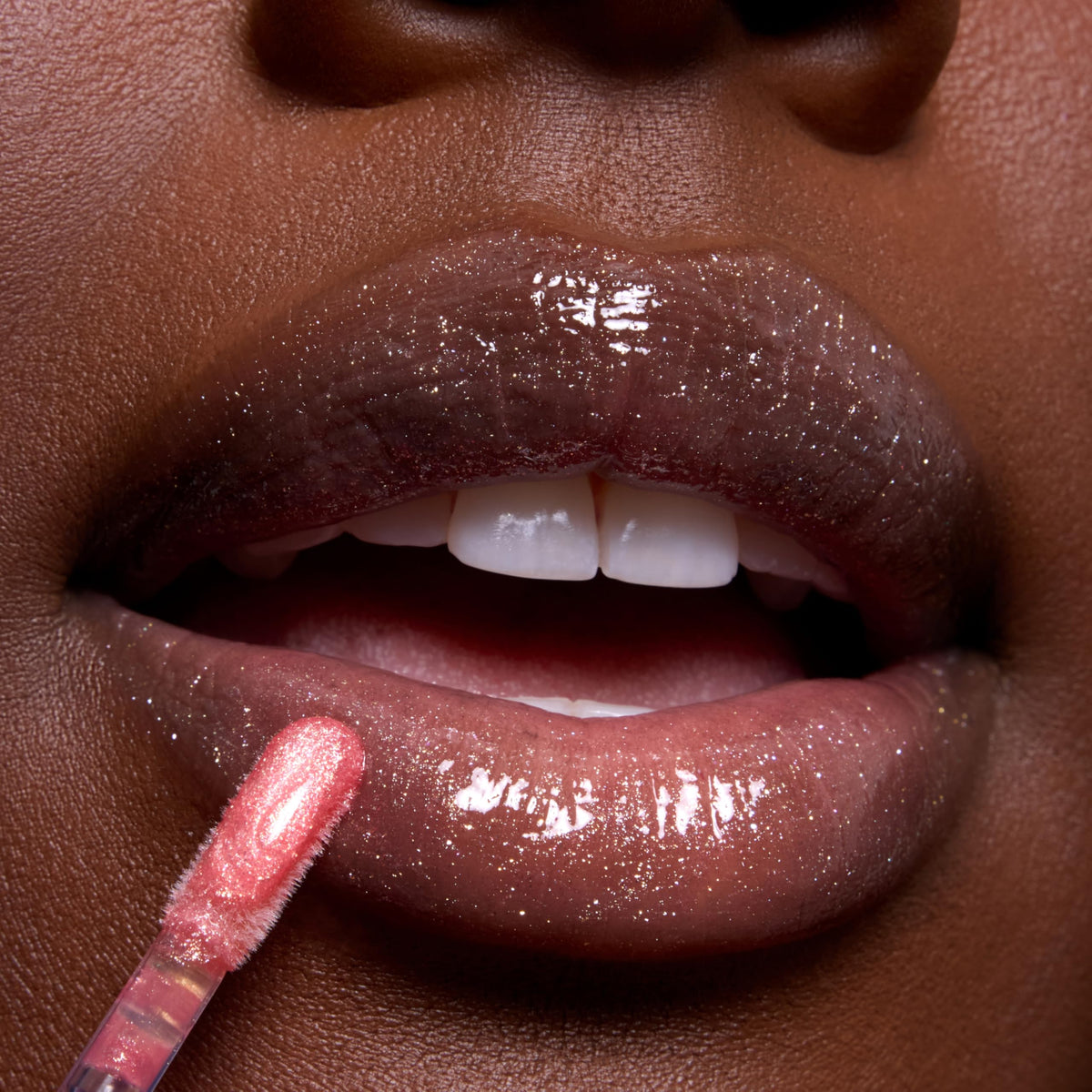 ColourPop open tube of Mademoiselle Belle gloss showing rosy pink formula and nourishing oils