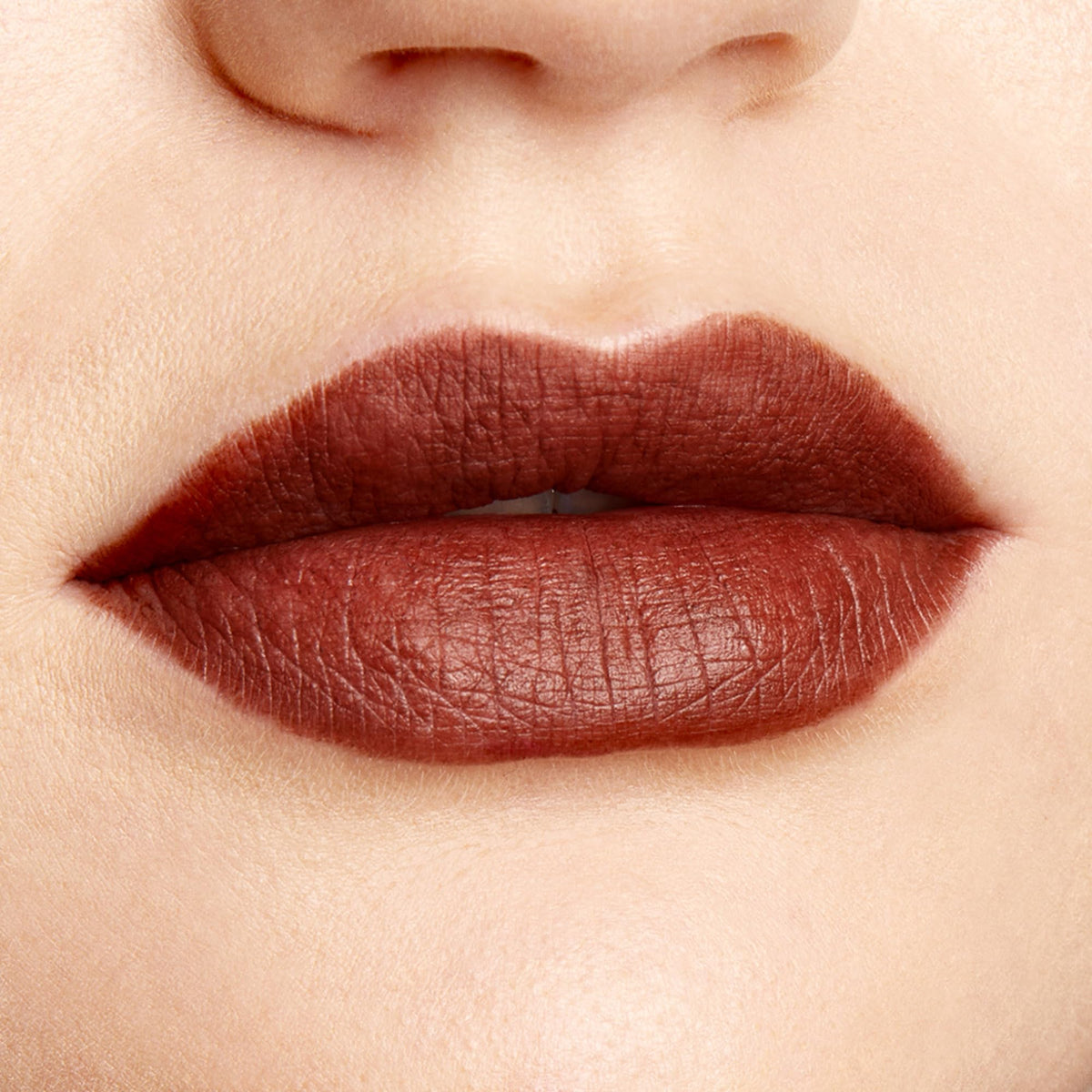 ColourPop lip pencil being applied to lips showing precise lining and long-wear