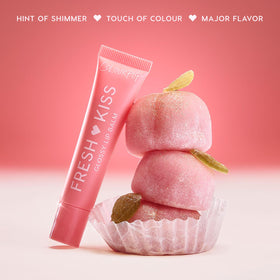 ColourPop Peach Mochi swiped on lips showing peach tint and plumping shine