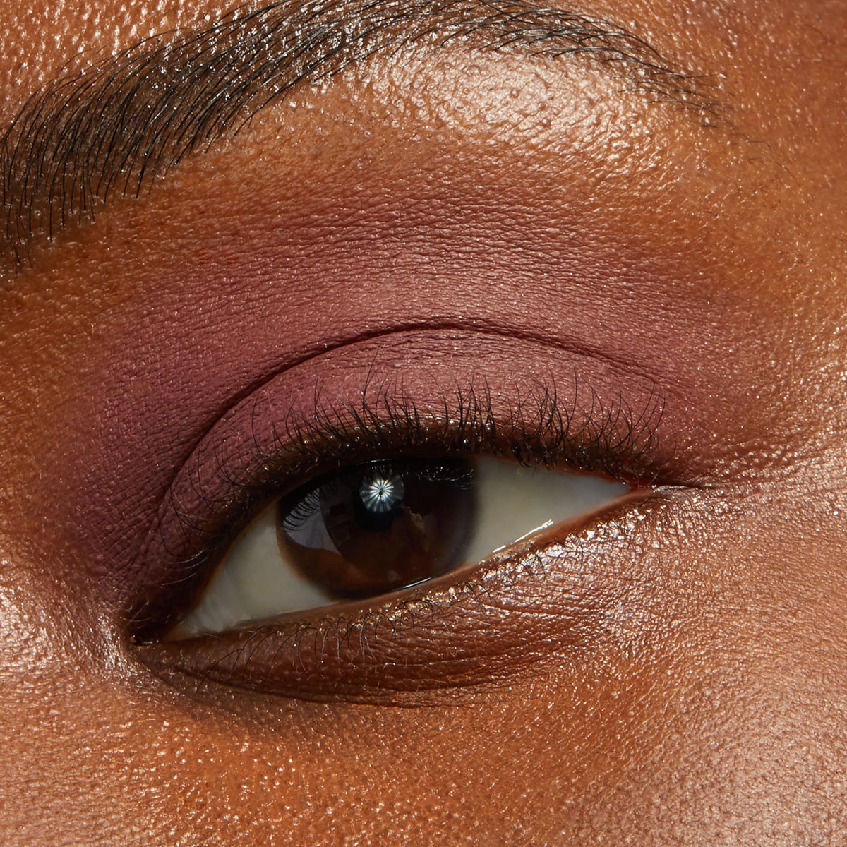 ColourPop Plum Tart cream texture swatch on arm illustrating rich pigmentation