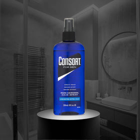 Consort bottle in hand to show scale and portable 8 oz size for travel convenience