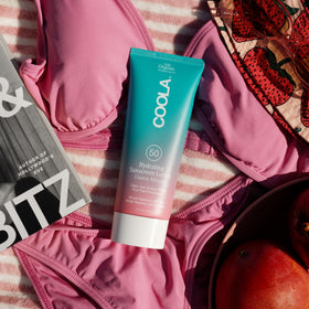 COOLA in a beach setting promoting long-day outdoor protection benefit