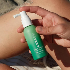 COOLA mist droplets close up showing lightweight, non-greasy texture