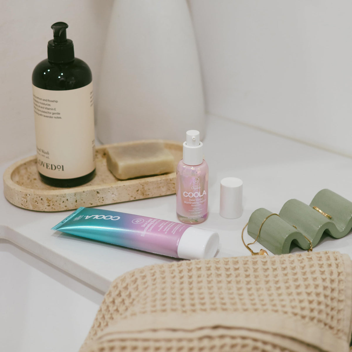 COOLA serum texture swiped on skin, illustrates lightweight hydrating finish